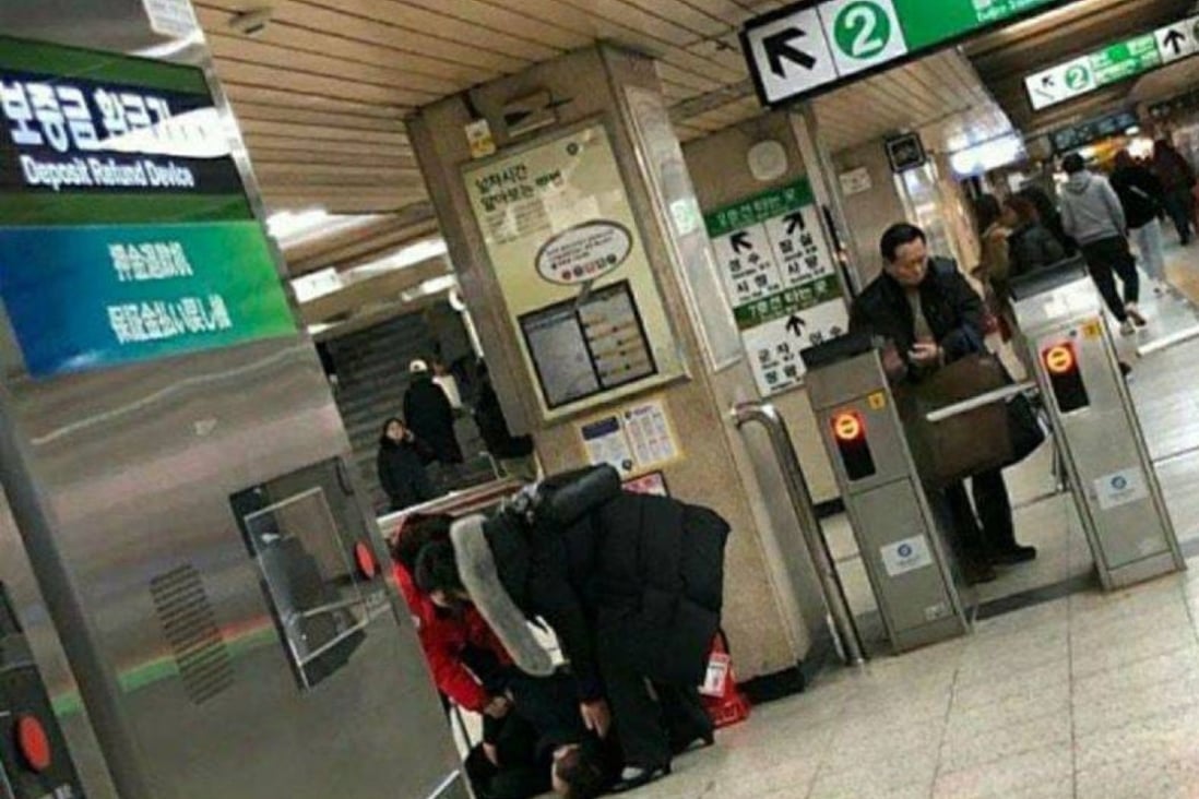A picture of a Chinese man passed out in a subway station in Seoul that was shared on an online forum caused concern about the spread of coronavirus in South Korea. Photo: Screengrab