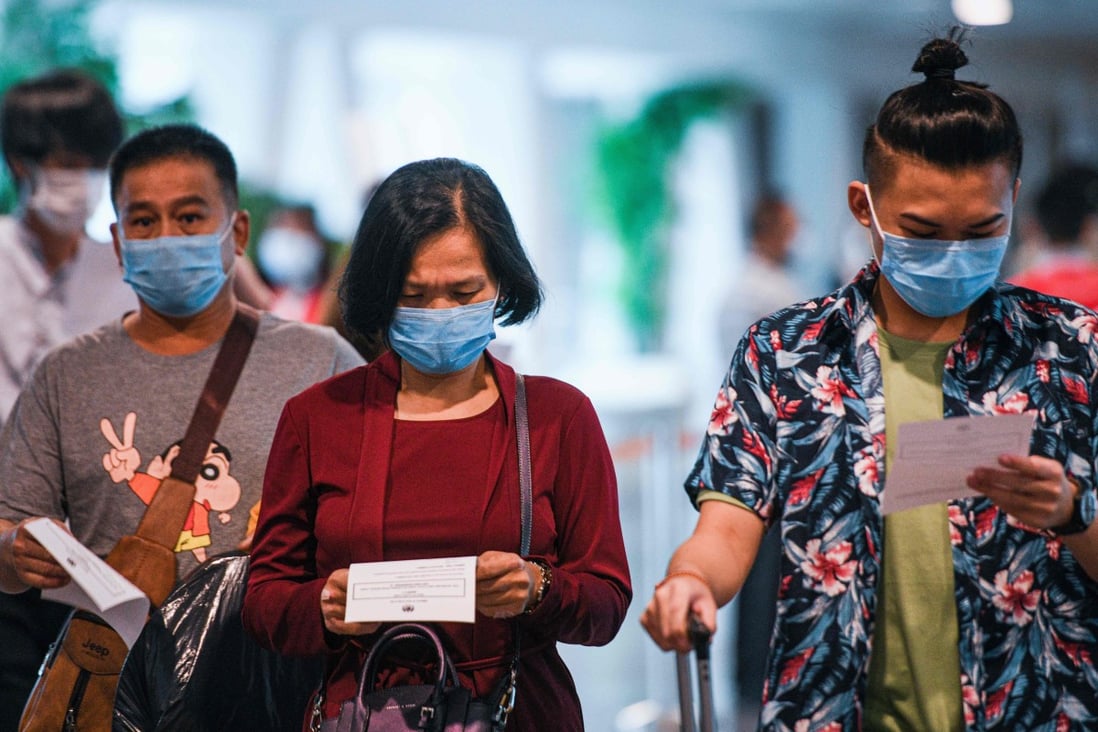 Passengers arrive at the Kuala Lumpur International Airport. Photo: AFP