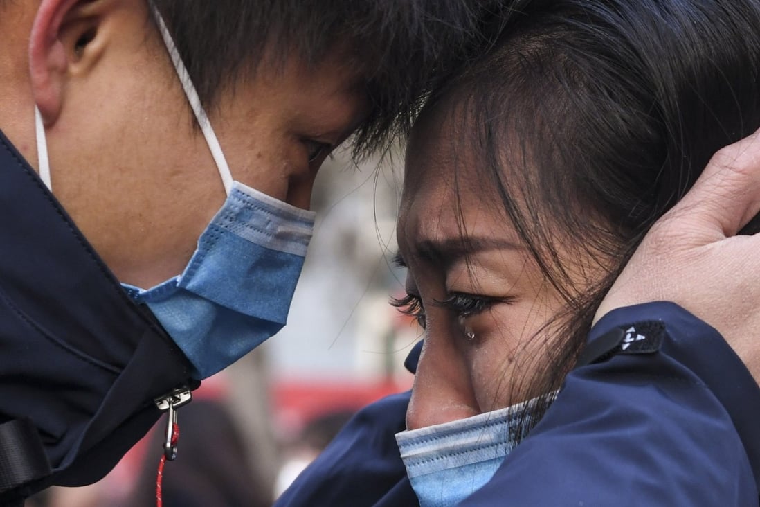 A member of a medical team leaving for Wuhan says goodbye to a loved one in Urumqi on January 28. Instead of looking for blame, we should be throwing our support behind the selfless doctors, nurses and other medical staff risking their lives to contain the outbreak. Photo: Xinhua