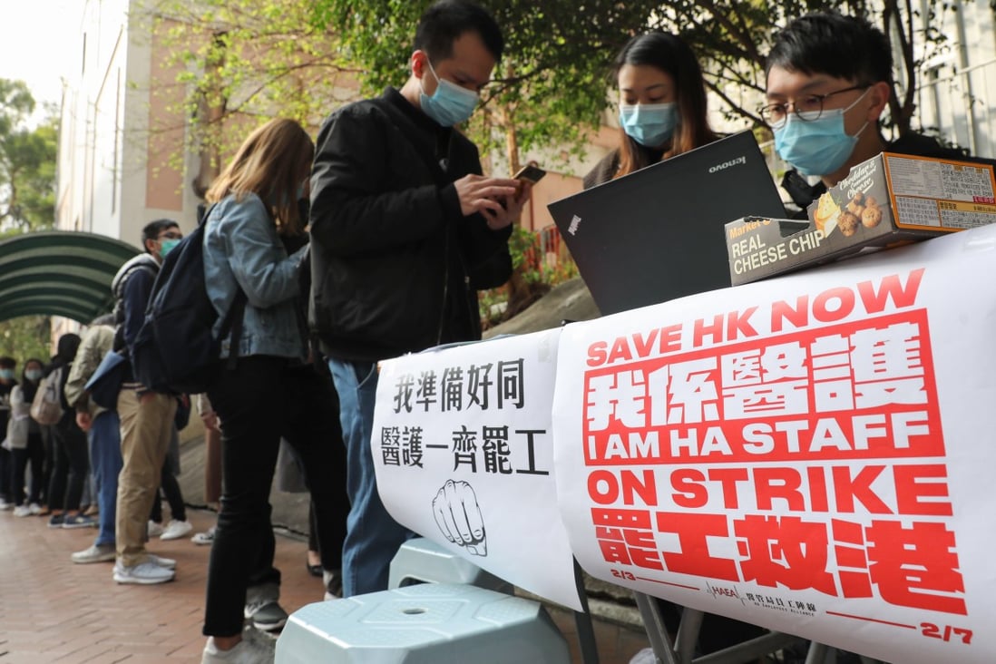 Members of the Hospital Authority Employees Alliance sign up people to the strike near Queen Elizabeth Hospital, Yau Ma Tei. Photo: Winson Wong