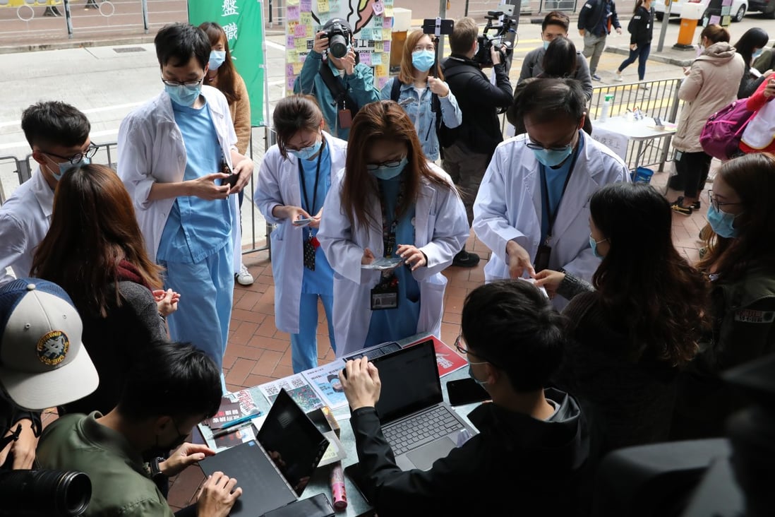Medical workers strike near Queen Elizabeth Hospital demanding Hong Kong close its borders with mainland China to curtail the spread of the coronavirus. Photo: Winson Wong