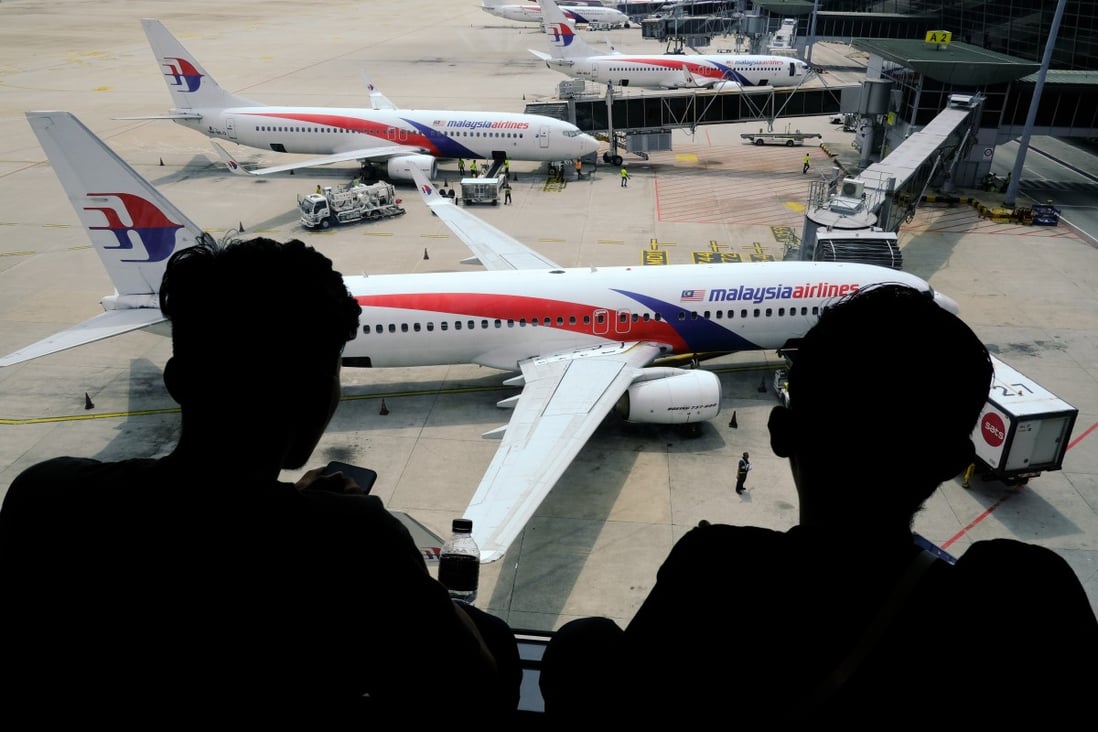 Malaysia Airlines aircraft stand on the tarmac at Kuala Lumpur International Airport on Tuesday. Photo: Bloomberg