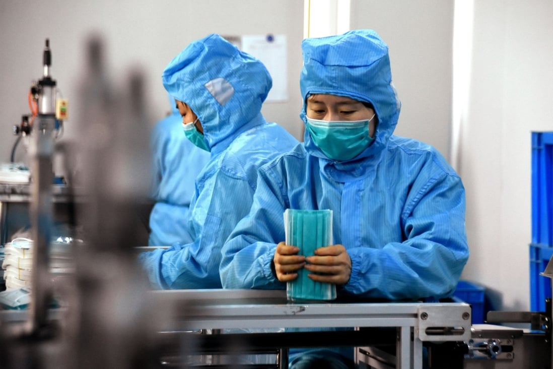 Workers make surgical masks in Dingzhou, in northern China’s Hebei province, with medical supplies in urgent demand. Photo: Xinhua