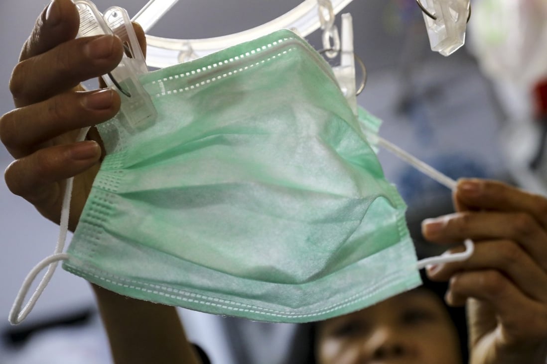 A single mother hangs her only mask up and has reused it for five days straight. Photo: Dickson Lee