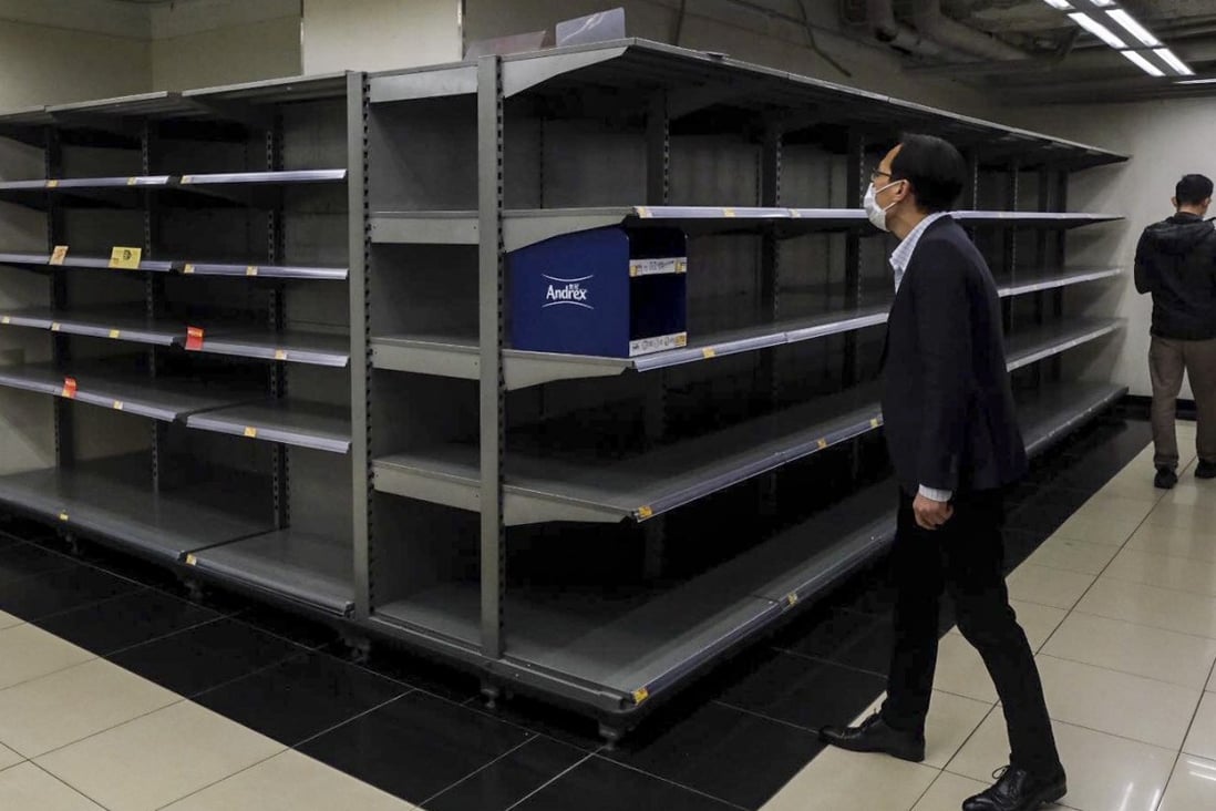 Empty shelves formerly stocked with toilet paper rolls in Causeway Bay. Photo: Sun Yeung