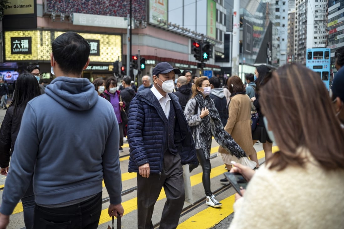 Masked pedestrians in Hong Kong’s Causeway Bay district. Prudential said it has received less than 10 claims from policyholders in Hong Kong and mainland China affected by the coronavirus. Photo: Warton Li