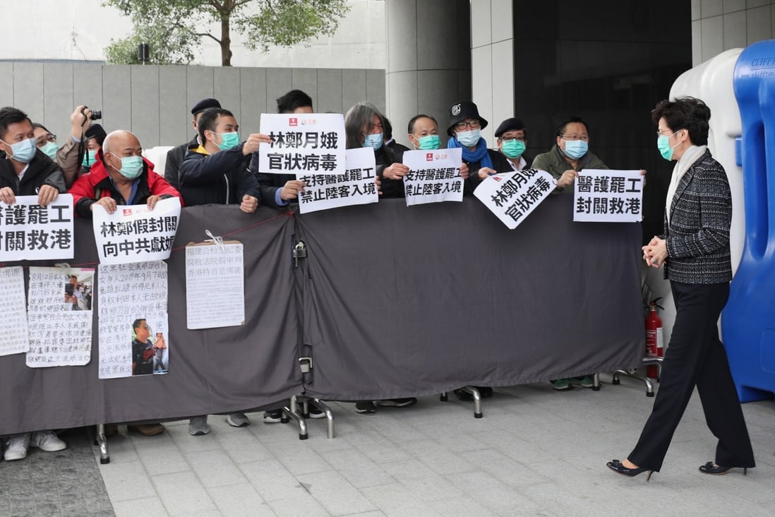 Chief Executive Carrie Lam Cheng Yuet-ngor, wearing a mask amid a coronavirus outbreak, receives petitions outside her office in Admiralty on February 4. Photo: Xiaomei Chen