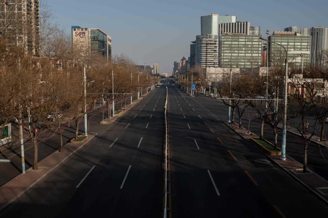 A deserted street in Beijing this week. The coronavirus outbreak has placed at least 27 mainland Chinese cities on lockdown and forced many Hongkongers to work from home. Photo: AFP