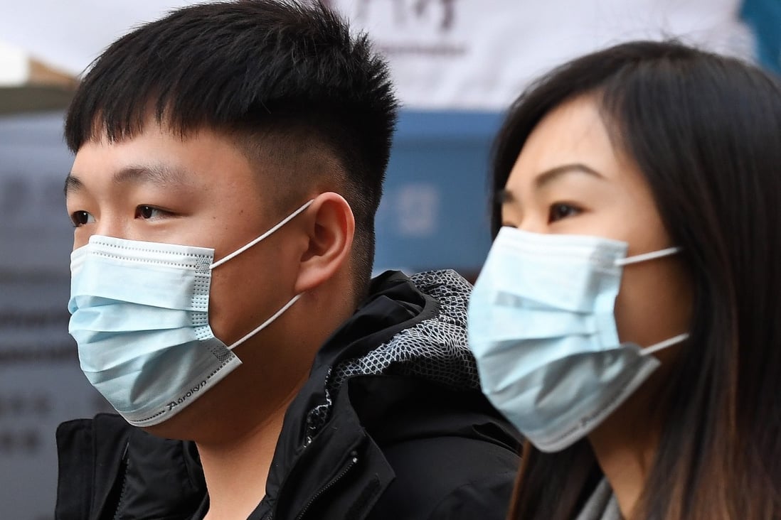 People wearing face masks in London. Photo: EPA