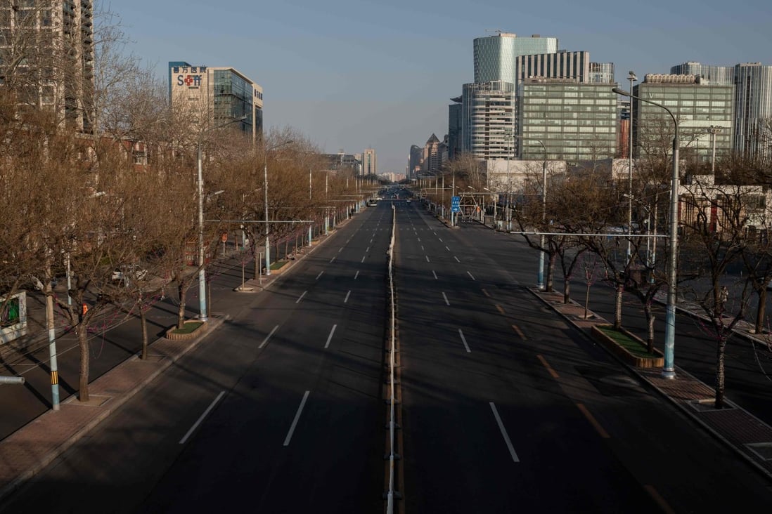 A deserted street is seen in Beijing on February 3, 2020. The coronavirus outbreak has seen the homestay industry suspend all bookings in the city until the end of February. Photo: AFP