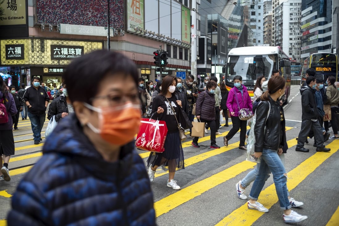 Pedestrians wearing protective masks in Causeway Bay. Hong Kong reported a death from the coronavirus and 42 infections as of Tuesday. Photo: Warton Li