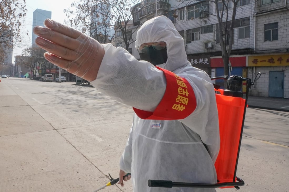 A volunteer carries out disinfection work in Wuhan in central China's Hubei province, epicentre of the coronavirus outbreak. Photo: Xinhua
