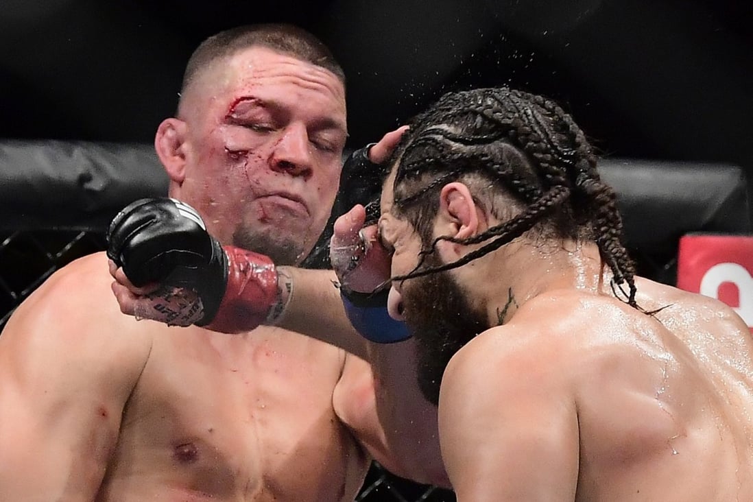 Jorge Masvidal throws a punch at Nate Diaz during UFC 244. Photo: AFP