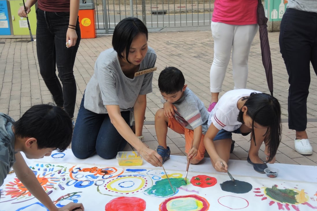 Hong Kong district councillor Clara Cheung creating artwork with children as part of her campaign leading up to November’s district council elections.