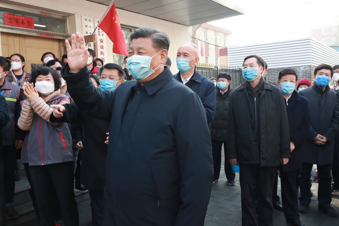 Xi Jinping visits a community in Beijing on Monday. The Chinese president said efforts to control the virus outbreak had reached a critical stage. Photo: Xinhua