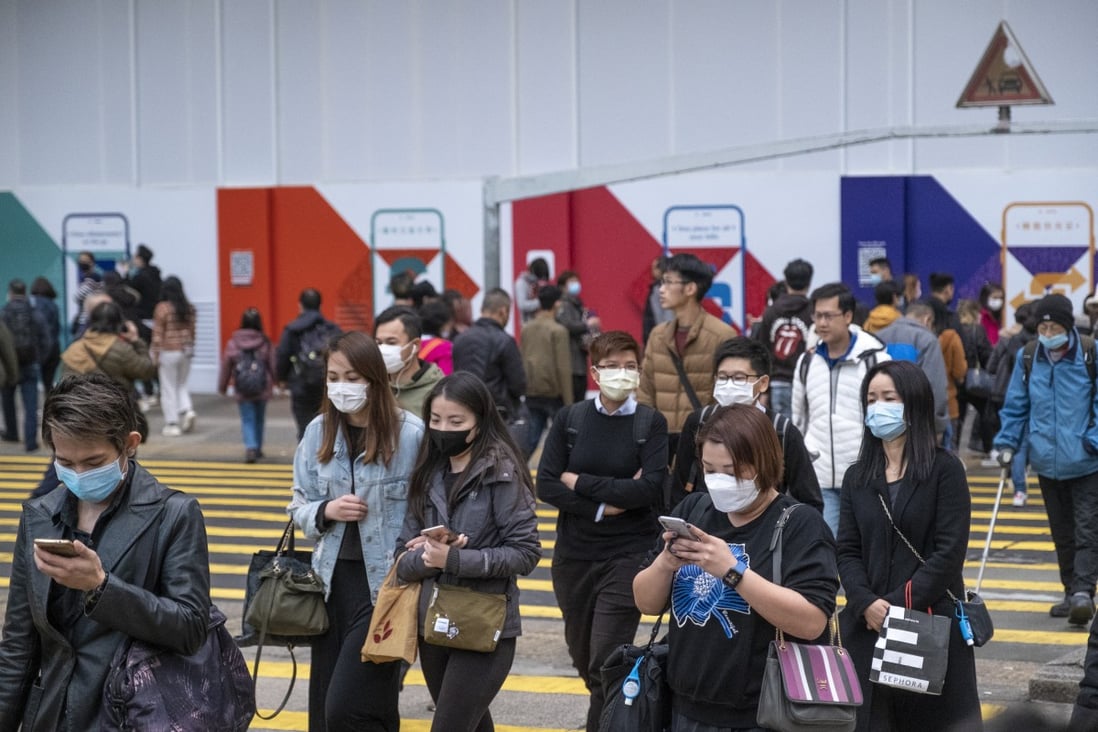 Pedestrians wearing protective mask walk in Mong Kok in Hong Kong, amidst the coronavirus outbreak. Photo: Sun Yeung