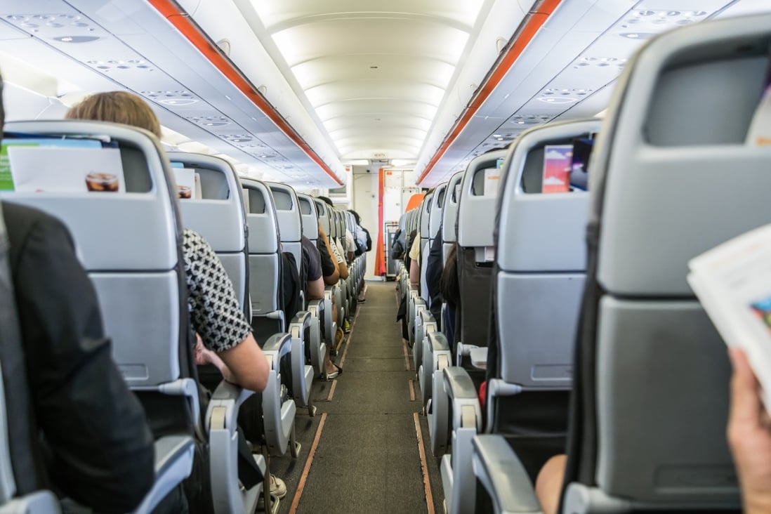 A modern aircraft cabin, in which the air is changed every two to three minutes, much more often than in an office, cinema, or classroom on the ground. To minimise the risk of catching a respiratory illness from a fellow passenger, choose a window seat, experts say. Photo: Getty Images/iStockphoto