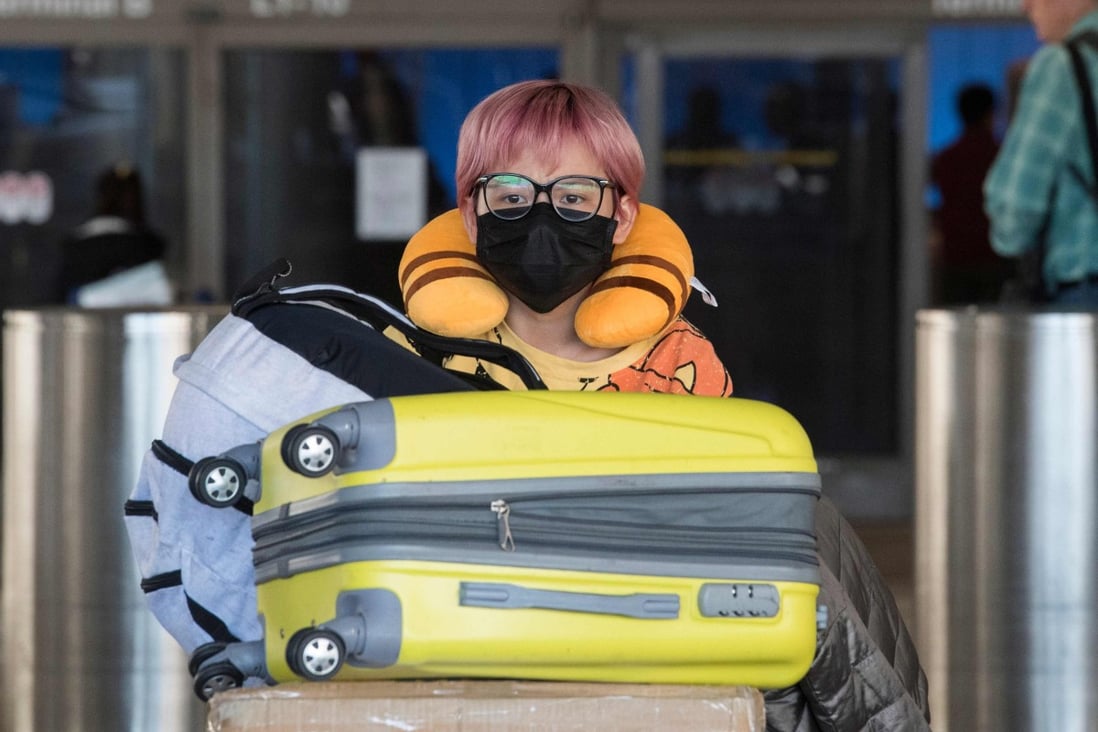 A passenger on a flight from Asia arrives at Los Angeles International Airport, California. Photo: AFP