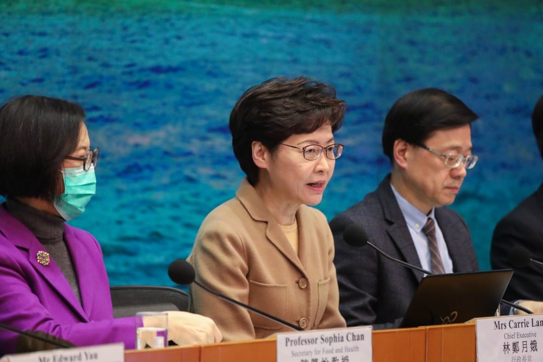 Carrie Lam, centre, has announced the setting aside of more cash to help the city cope with the coronavirus outbreak. Photo: Felix Wong