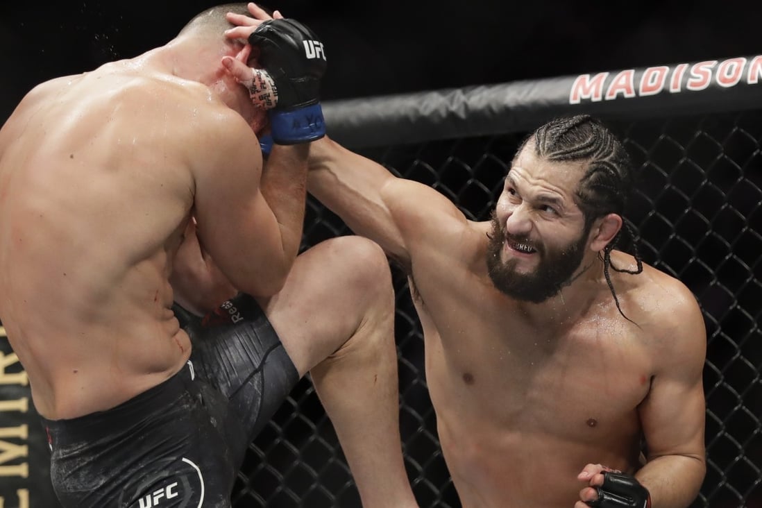 Jorge Masvidal punches Nate Diaz during the second round at UFC 244. Photo: AP