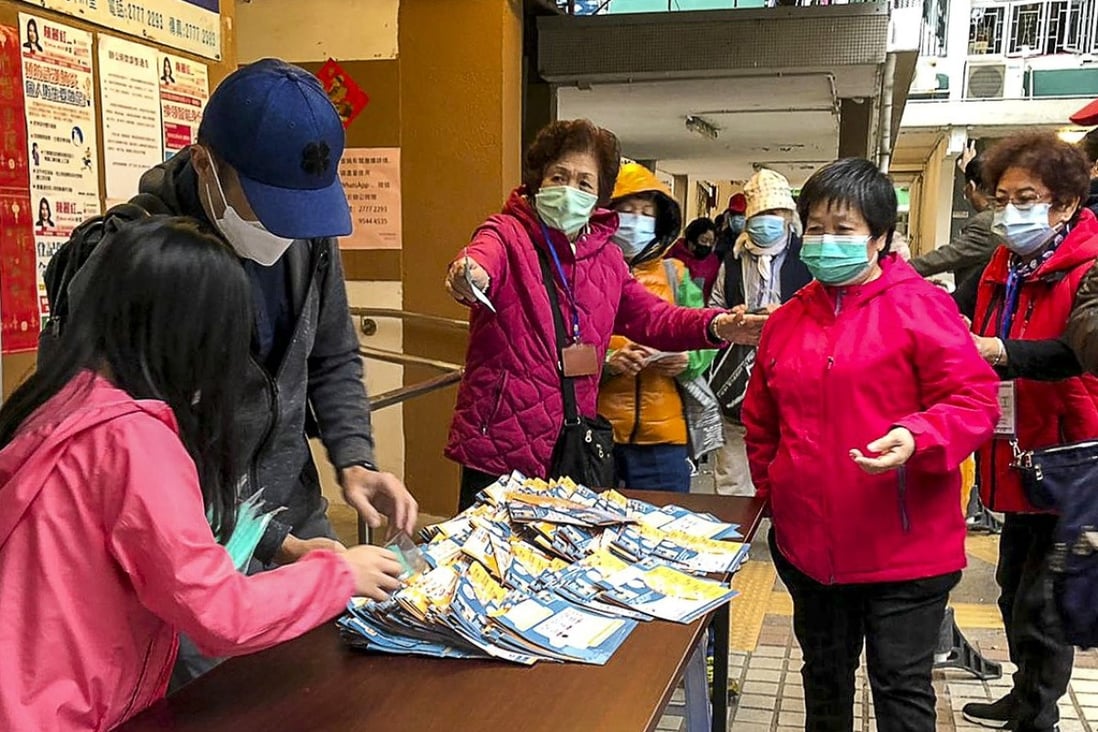 Elderly Hong Kong residents queue up for surgical masks on Sunday. Photo: Alvin Lum