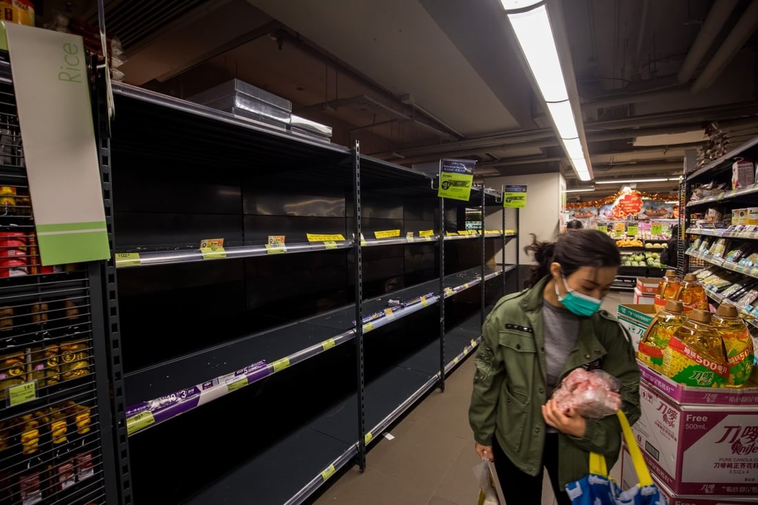 Empty shelves in a Hong Kong supermarket on February 5. International production of countless goods and services have slowed down or even stopped in the wake of the coronavirus. Photo: Bloomberg
