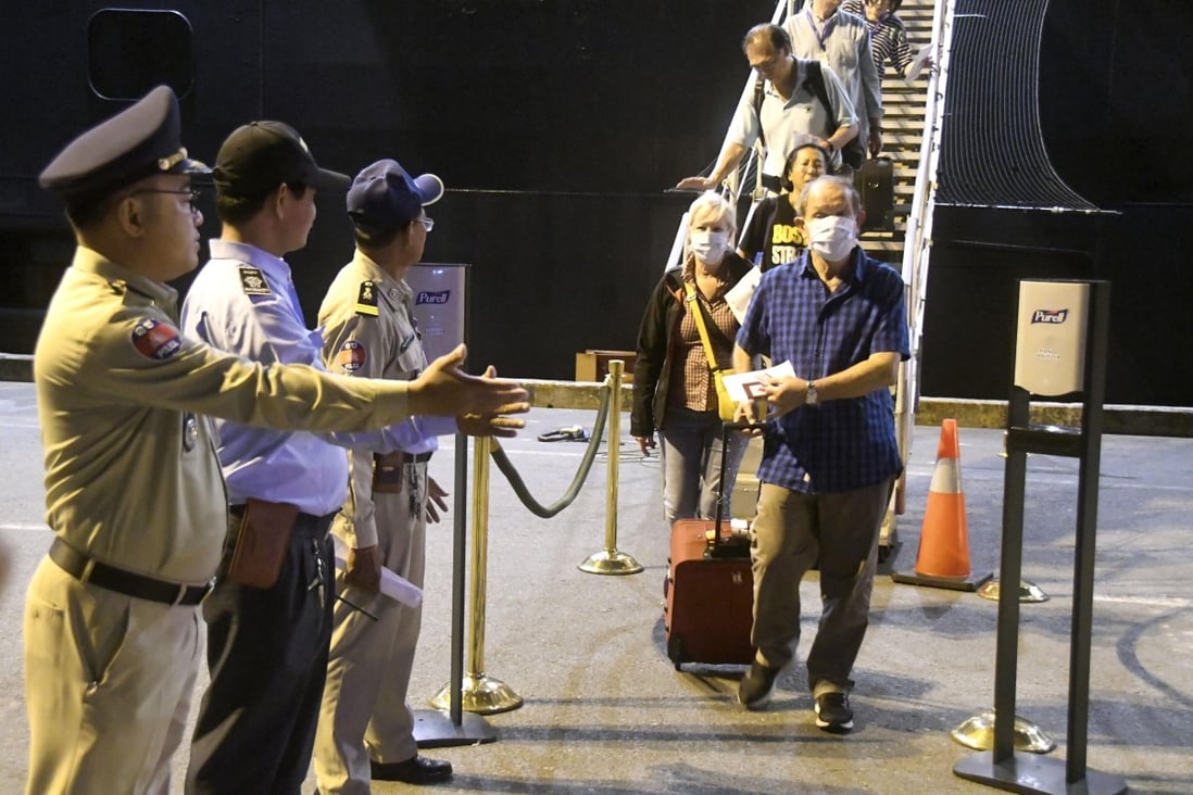 Passengers disembark from the Westerdam cruise ship at the port of Sihanoukville in Cambodia on February 15, 2020. Photo: Kyodo