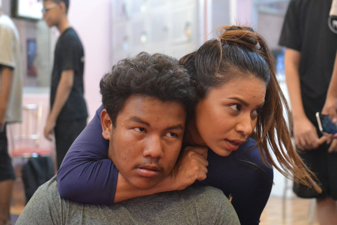 Khin Cham Myae Thu (right), also known as Gloria Judo, teaching martial art techniques to her students at her Body Art studio in Yangon, Myanmar. Photo: Lorcan Lovett