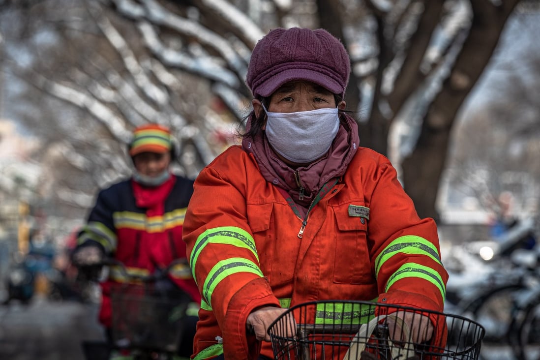 A worker seen in a protective face mask in Beijing on February 7, 2020. Photo: EPA-EFE