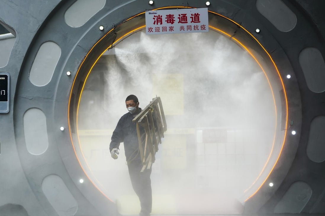 An employee walks through a disinfection gate set up to curb the spread of the novel coronavirus before leaving a working area at a company in southwest China's Chongqing municipality. Photo: Xinhua