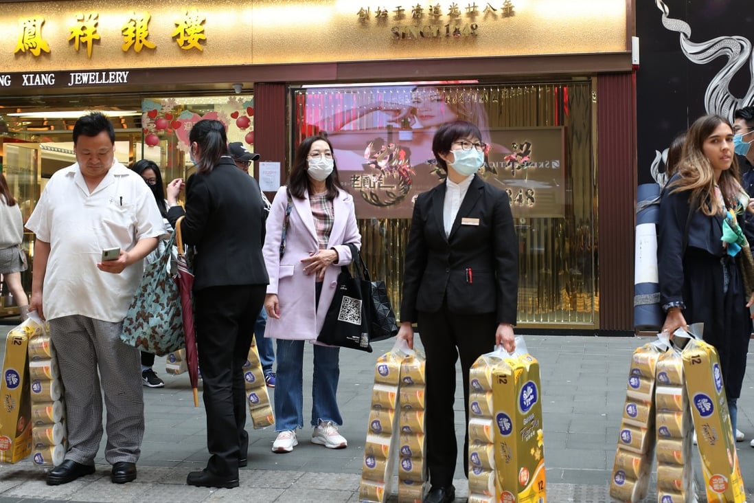 Shoppers seen with bags of toilet paper in Causeway Bay. Hongkongers have been snapping up surgical masks, health care products and toilet paper rolls amid the coronavirus outbreak. Photo: Xiaomei Chen