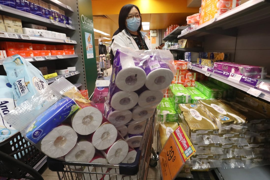 A shopper stocks up on toilet rolls at a supermarket in Hong Kong on February 5 amid fears over the coronavirus outbreak. Photo: Nora Tam