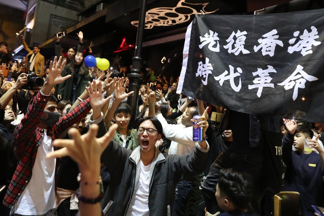 Protesters carry a flag bearing the slogan “Liberate Hong Kong; Revolution of our times” at a protest in January. Photo: Sam Tsang