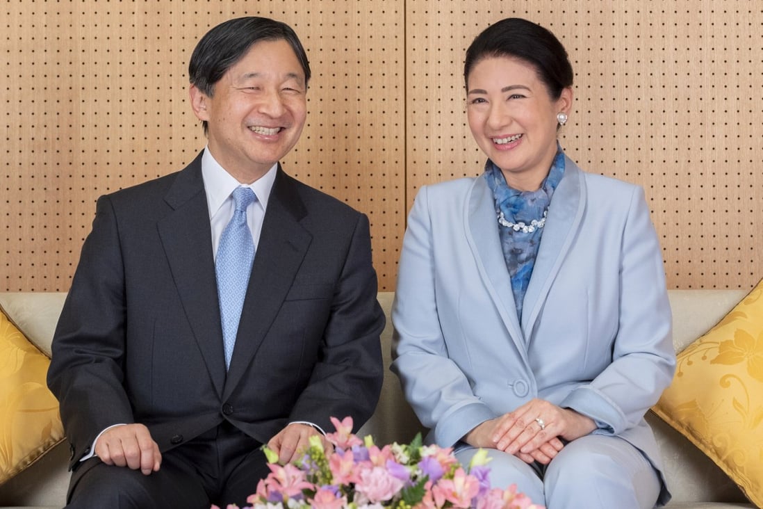 Japan's Emperor Naruhito and his wife Empress Masako smile at their residence in Tokyo, in this photo released ahead of his 60th birthday. Photo: AP