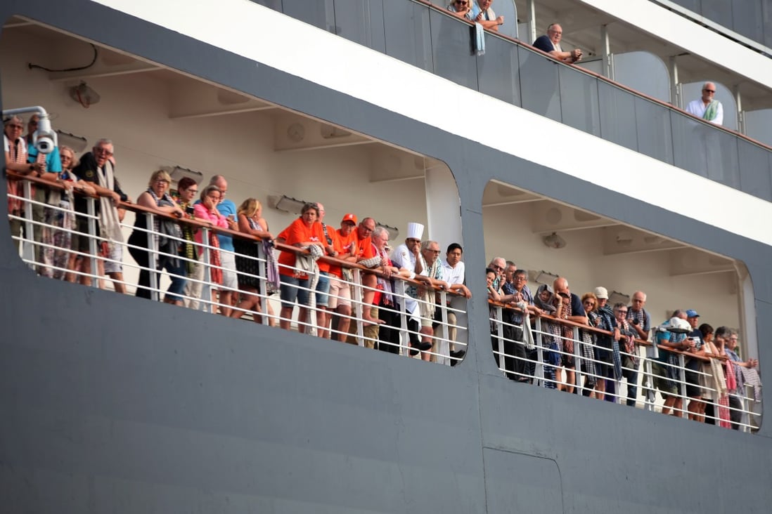 Passengers gather on decks of the Westerdam cruise ship before disembarking on February 14, 2020, in Cambodia. Photo: Xinhua