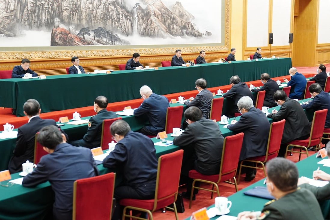 Communist Party and state leaders attend a meeting in Beijing on Sunday to advance the work on coordinating the prevention and control of the epidemic. Photo: Xinhua