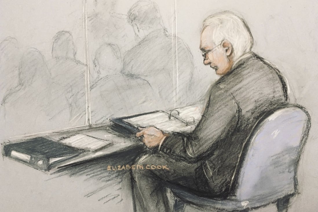 A court artist’s sketch of Wikileaks founder Julian Assange in the dock reading his papers for his extradition hearing on Monday. Photo: AP