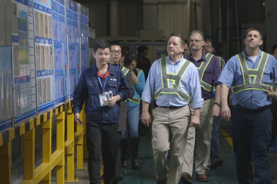 American Fuyao management team members tour a Fuyao factory in Fujian, China, in a screen grab from the documentary American Factory. Photo: AP