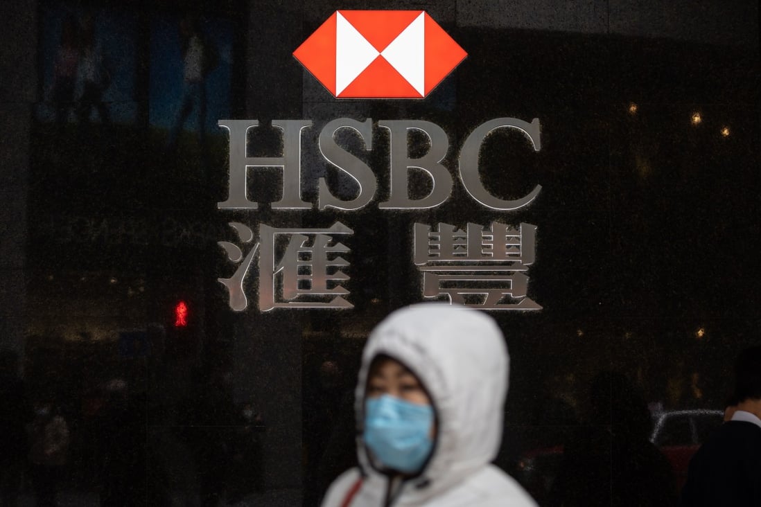 A woman walks past an HSBC branch in Central district, Hong Kong, China, 19 February 2020. Photo: EPA-EFE