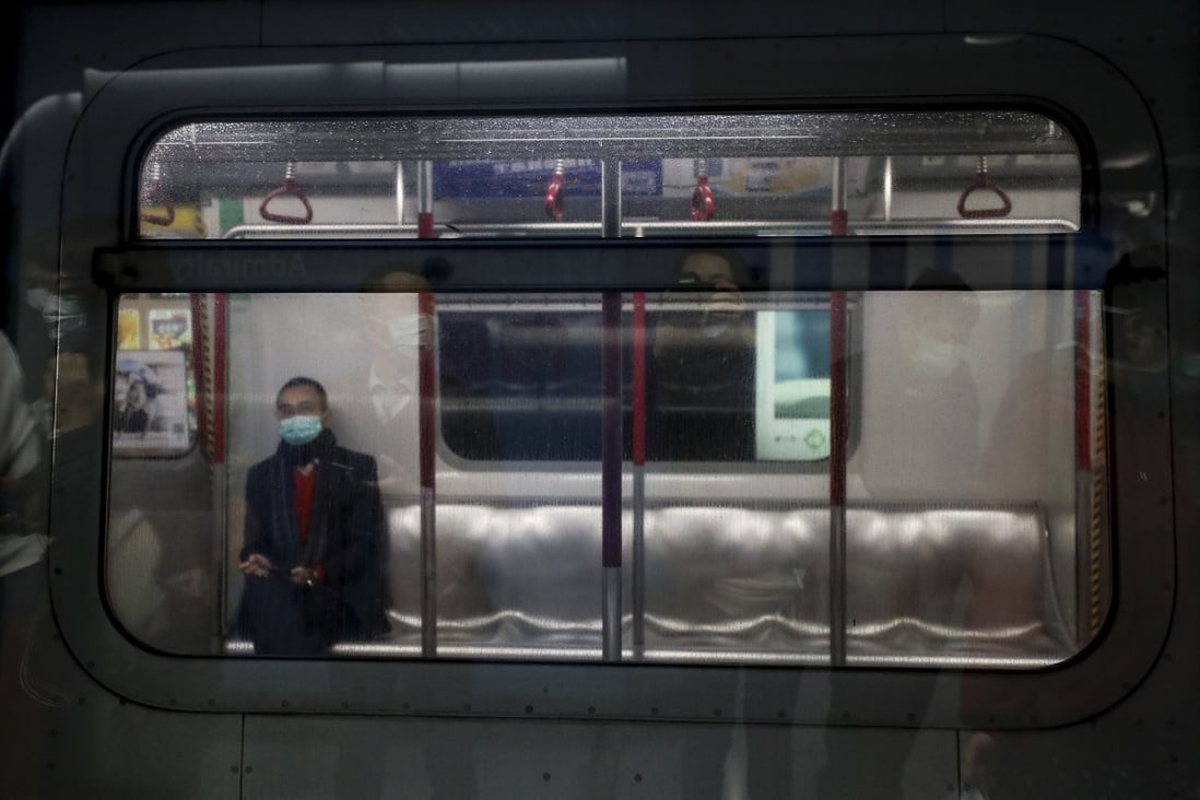 A man sits on an MTR carriage at Causeway Bay station. Ridership figures are down on the MTR, as the coronavirus affects Hong Kong. Photo: Nora Tam