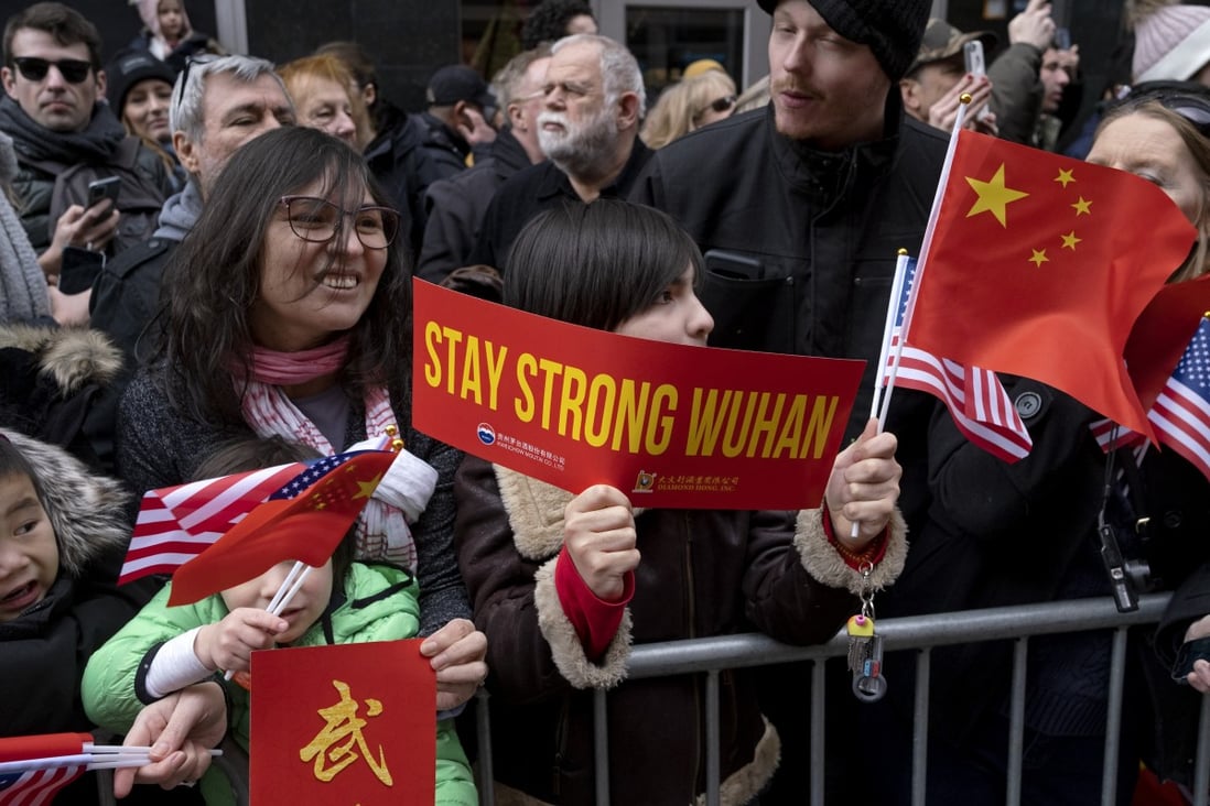 A sign of support for Wuhan during the Lunar New Year parade in New York City’s Chinatown on February 9. Wuhan natives in the US have rallied to donate medical supplies and other materials to their hometown. Photo: AP