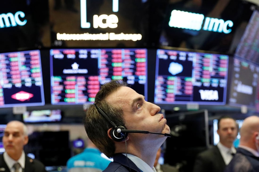 A trader works on the floor of the New York Stock Exchange shortly before the closing bell as the market takes a significant dip in New York on February 25, 2020. Photo: Reuters