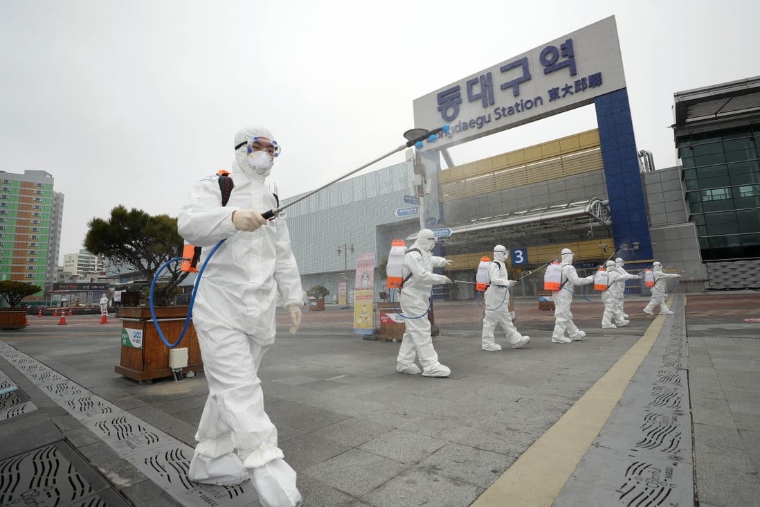 Quarantine officials in Daegu, South Korea, carry out a disinfection operation. Photo: YNA/DPA