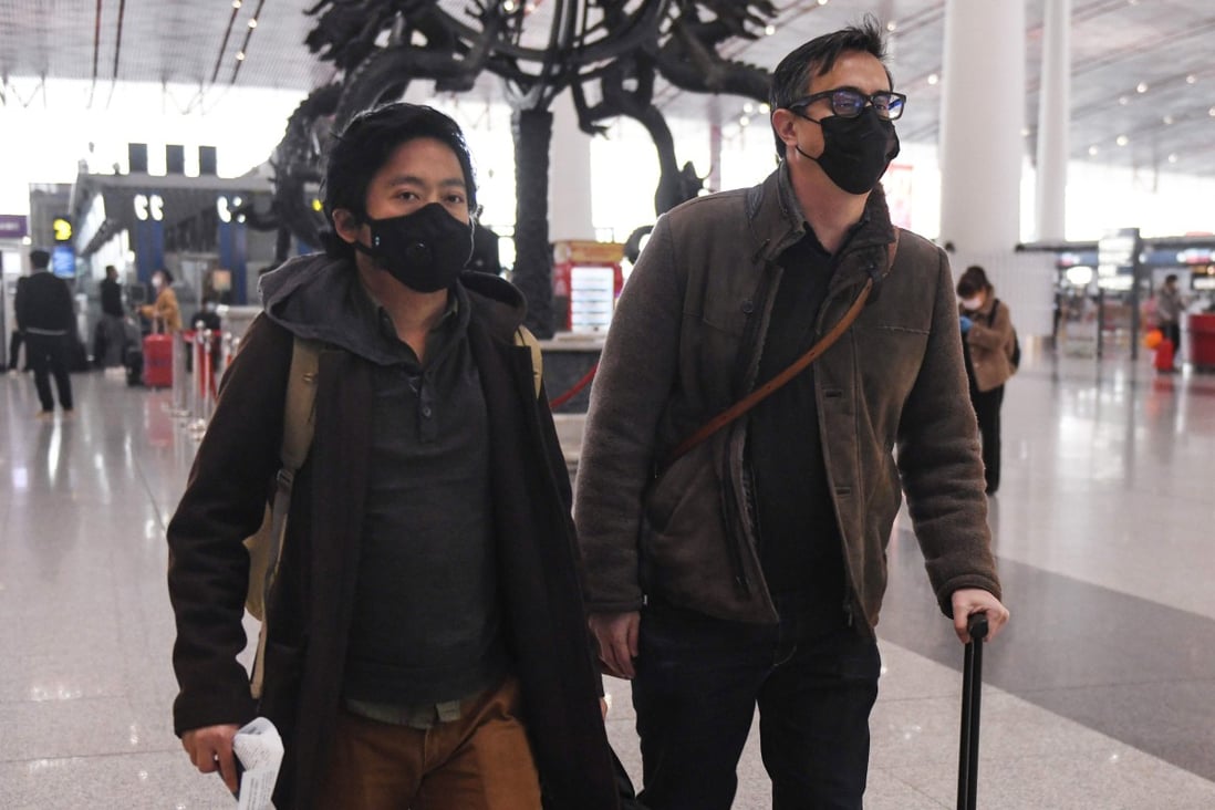 Wall Street Journal reporters and Philip Wen, left, and Josh Chin at Beijing Capital Airport last month. Photo: AFP