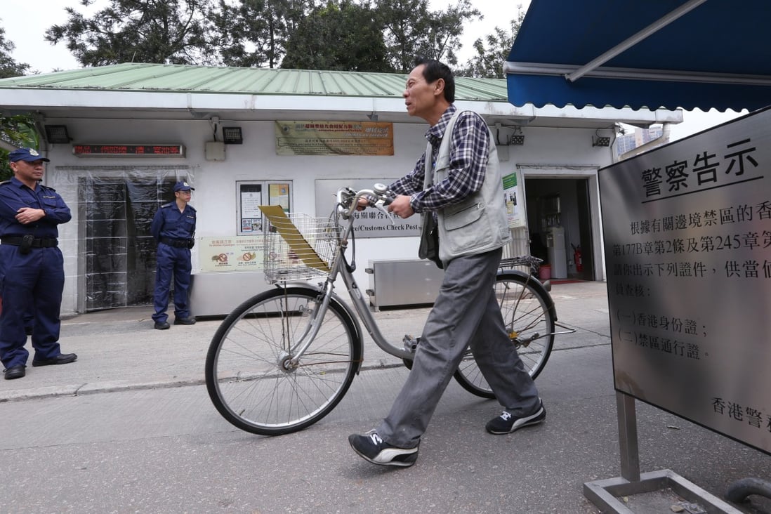 A resident uses the Chung Ying Street Police Post in Sha Tau Kok. Photo: SCMP Pictures