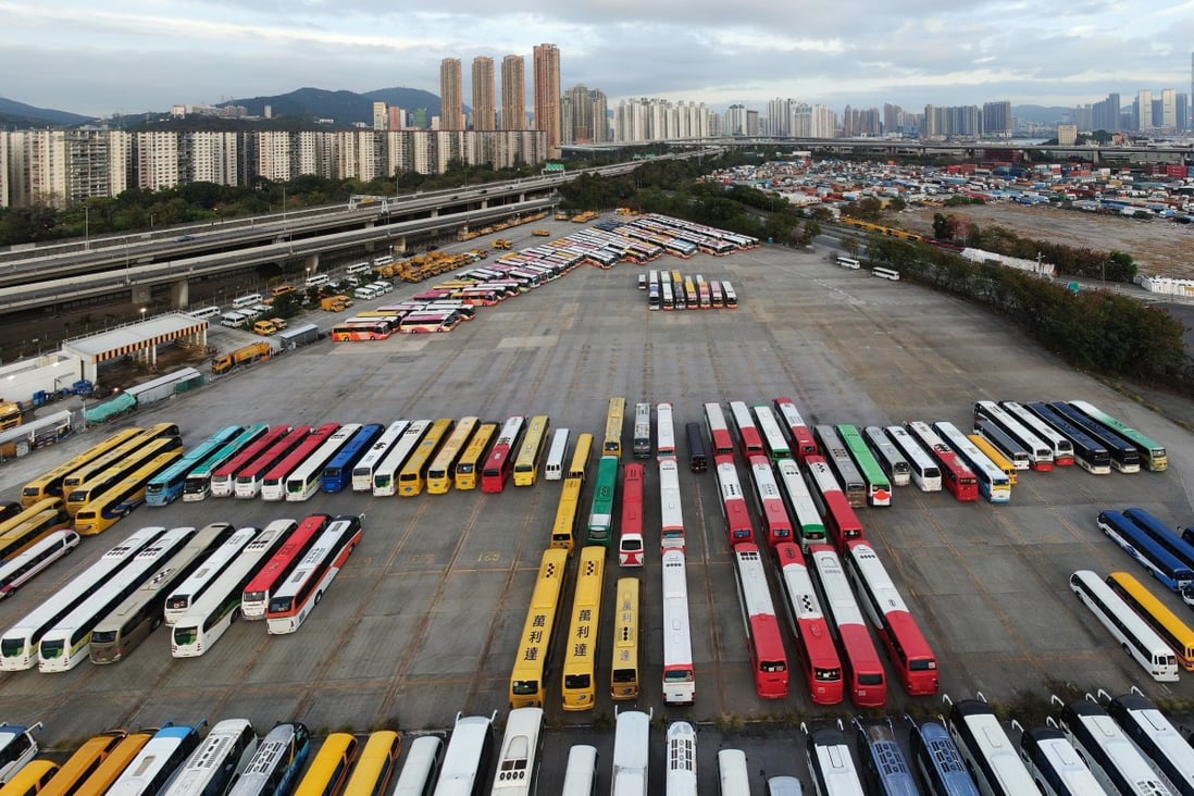 School buses sitting idle at a public car park near Kwai Chung Cargo Terminal in Hong Kong’s Sham Shui Po on 29 February 2020. Schools in the city are out until at least Easter, as the government orders students and civil servants to stay home amid the city’s coronavirus outbreak. Photo: Martin Chan