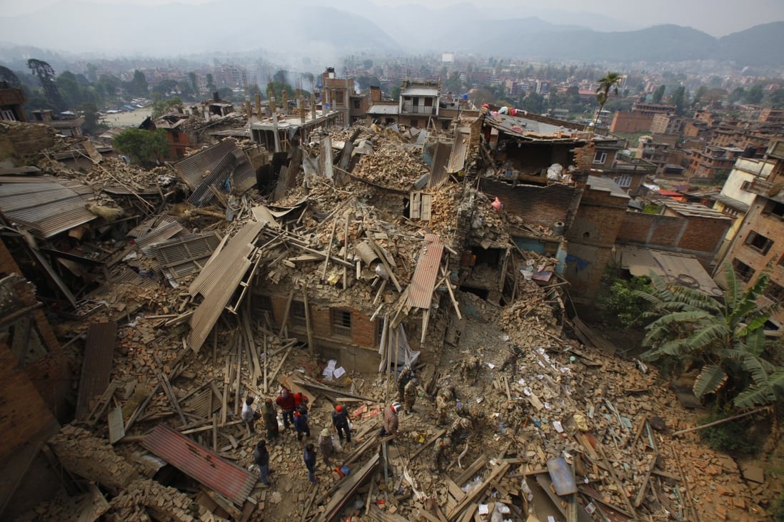 Rescuers sift through debris as they search for victims of earthquake in Bhaktapur near Kathmandu, Nepal on April 26, 2015. Photo: AP