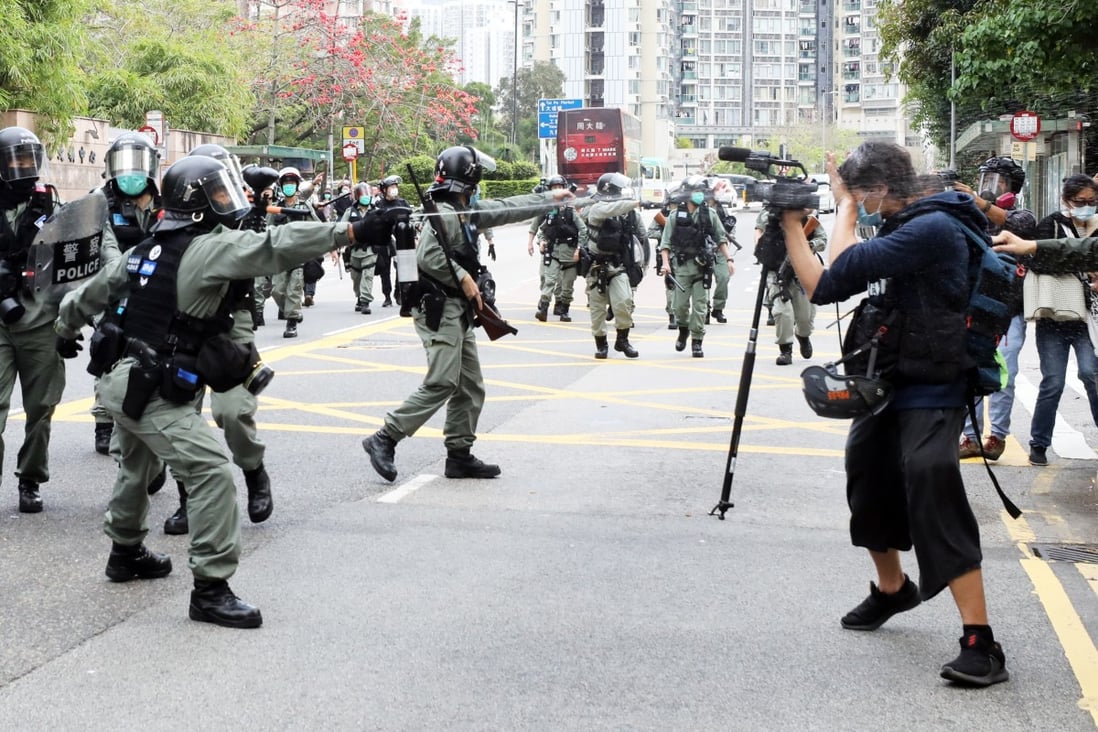 Police pepper spray local reporters during an operation to break up an anti-government protest in Hong Kong’s Tai Po area on March 8. Photo: Dickson Lee