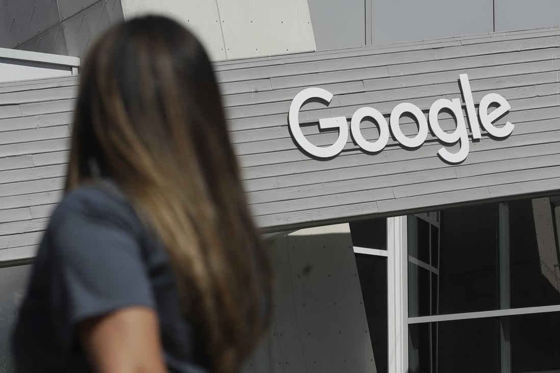 A woman walks below a Google sign at the company’s main campus in Mountain View, California. Since Covid-19 began to spread, Google has aggressively intervened in some of its most popular online services to limit the spread of misinformation. Photo: AP