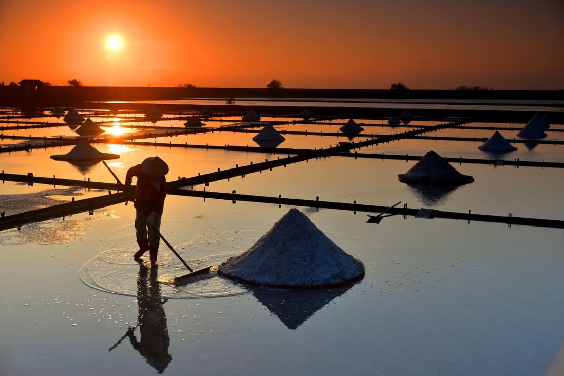 A golden sunset over Jingzaijiao Salt Field in Tainan, which was reopened in the early 2000s to keep the ancient tradition of sea-salt making alive. Photo: Liao Fu-lin